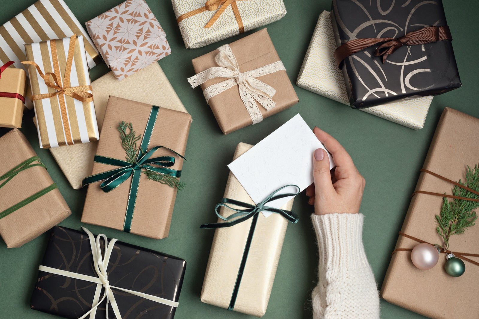 Christmas background with gift boxes over green backdrop